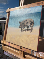 Angled detail image of an oil painting of a big spotted pig on a beach