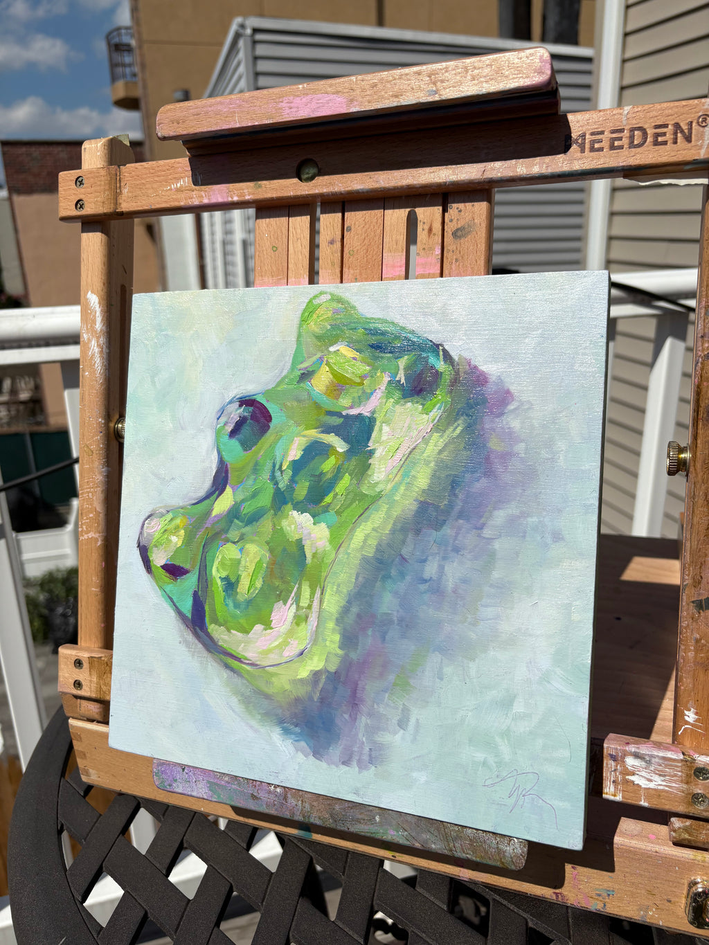 Colorful, up-close oil painting of a green, translucent gummy bear. Colors of pink, yellow, purple, and deep magenta accent the highlights and shadows making it appear to glow.