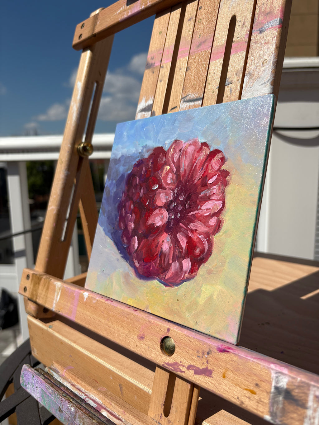 Colorful close-up study of a single raspberry, with dramatic lighting and brightly tweaked hues - 6x6in oil painting on canvas panel - detail, angled photo 