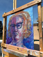 Impressionist self-portrait oil painting of a woman with curly amber hair and dark cat-eye glasses, painted in cool purples, blues, and warm golds against a violet background with expressive loose brushwork.